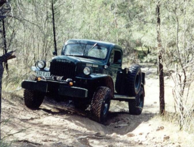 Desoto Power Wagon
From Ron Thallon, Australia
It was originally sold the State of Victoria Railways , and stayed for 20 years. Then ended up with the New South Wales Bush Fire Brigade with a water tank on the rear. I was told there were some Power Wagons assembled in the U.K., so that may explain the English KEW motor and electrics, then exported from there to Australia.
Update from Ron, 18Jan05: The vehicle is definitely ex Victorian Railways...but was sold to the NSW Bush Fire Brigade in the early sixties...This fits in with the my winch research and dates the vehicle approx 56/57. So the railway did purchase the original vehicle, but only had it 6 years or so and all the serial numbers are correct as well as the possible tow truck configuration. The problem with the [mismatched] chassis number is resolved: Apparently it was involved in an accident and hit a tree or bridge. [must have been a bloody big tree] as the front chassis rails were bent. Solution ...the front rails were cut off and replaced with two rails which were cut from a WW2 weapon Carrier and welded onto the original rails. The cut was just behind the steering box. A 5/16 inch reinforcing plate was then bolted to the outside of each chassis rail. All this was done in a small outback country town. Good old Aussie ingenuity. So the original Vic rail history is correct... just shorter. The number on the grafted chassis rail is from a WW2 weapon Carrier manufactured in 1942.
