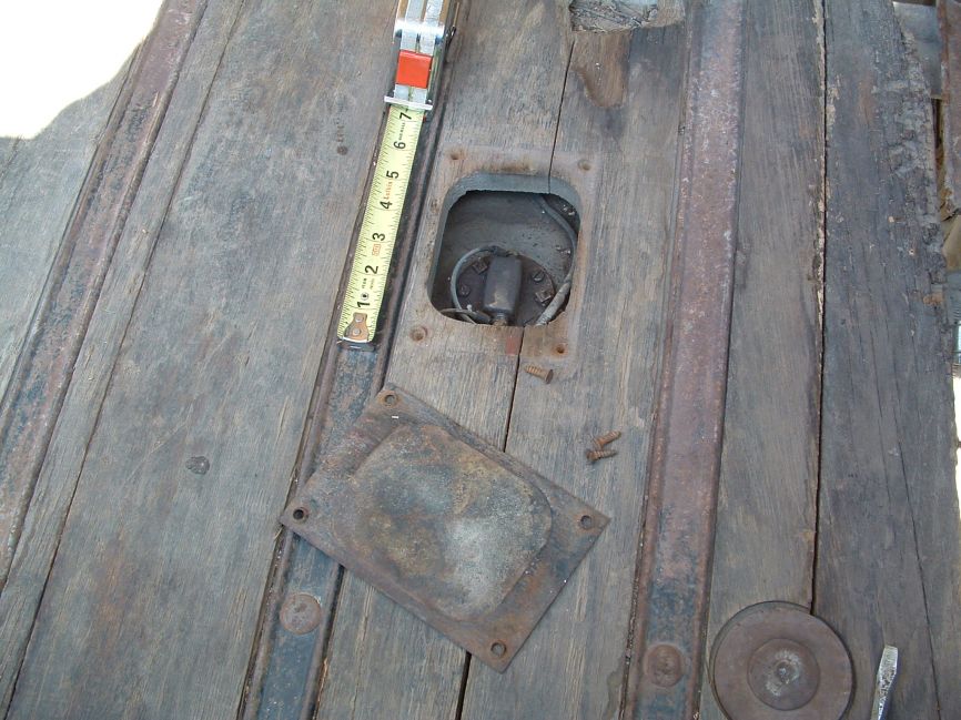 Fuel tank float access hole through bed wood #2.
Hole was cut rough in size.
